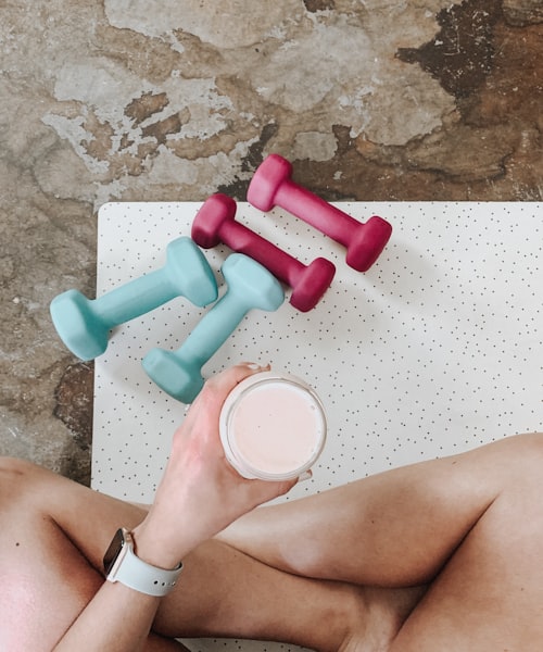 Woman with dumbbells at home